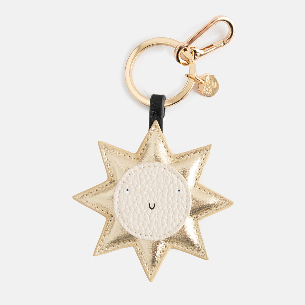 gold sun shaped padded leather look bag charm or large key ring