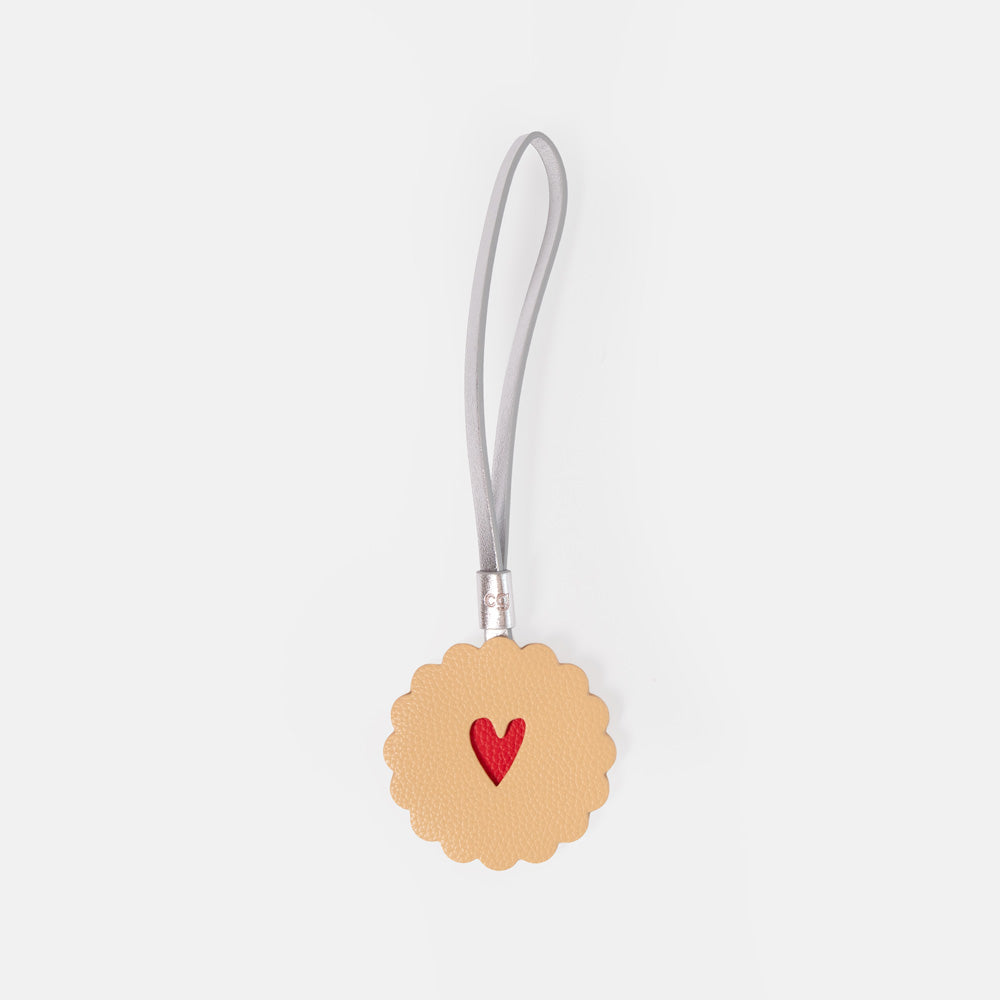 jammy dodger style bag charm on a silver strap