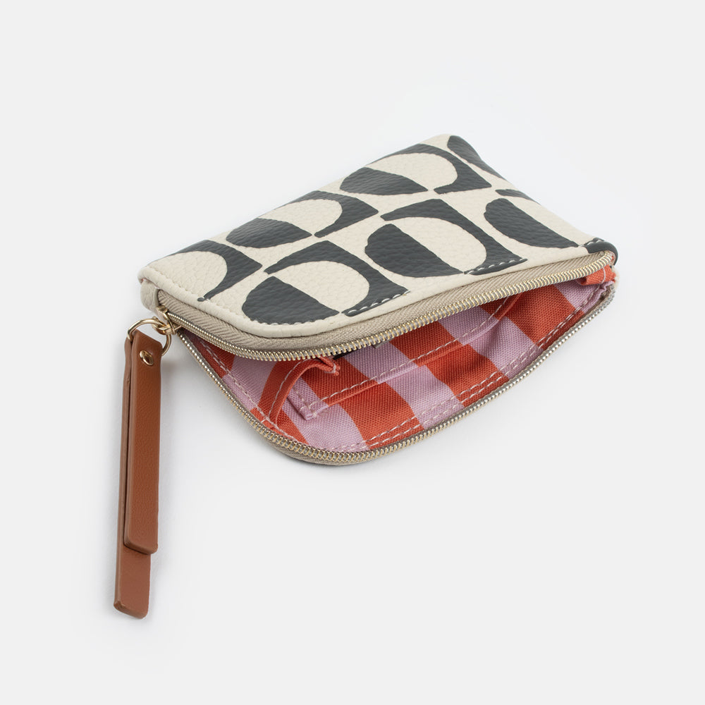 black and white monochrome geometric print leather look corner purse with pink and orange striped lining