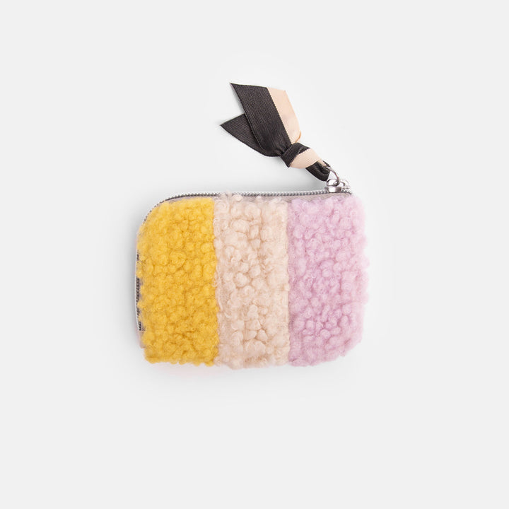 synthetic borg corner purse in cream, lilac and yellow with heart print lining, internal pockets and contrast grosgrain zip pull