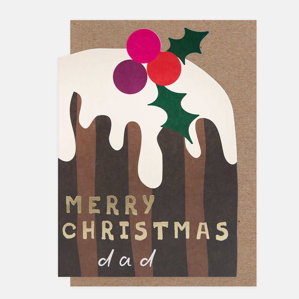A Christmas greeting card featuring a die cut christmas pudding with white icing, green holly leaves, and pink/red berries, with the text 'MERRY CHRISTMAS dad' on a kraft paper background.