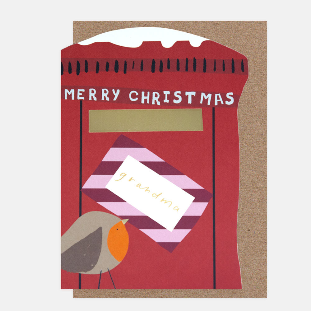 A die cut Christmas card in the shape of a post box with a robin holding a letter and the text 'merry christmas grandma'