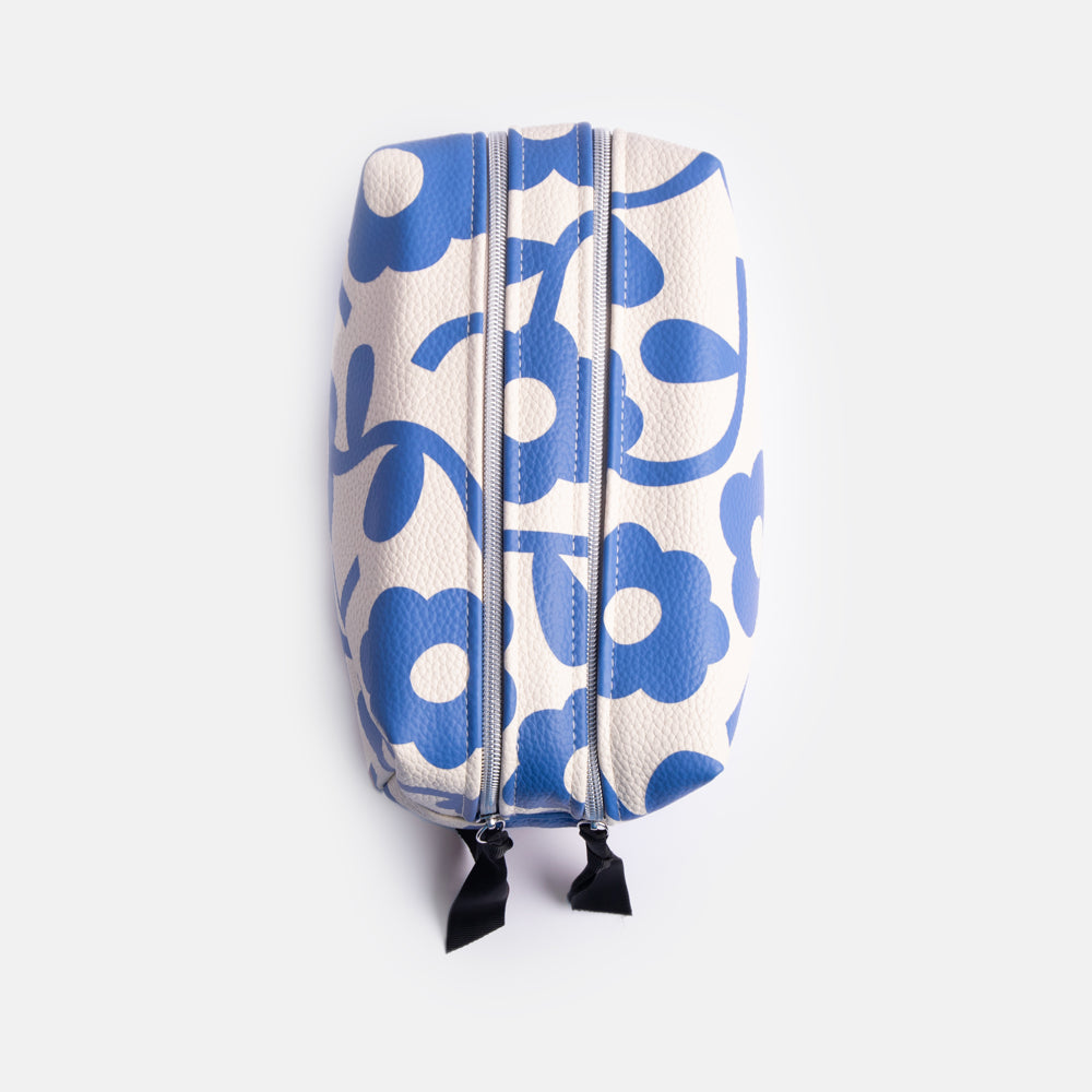 leather look PU large travel wash bag in blue floral design, with double zip opening, grab handle, heart print lining and grosgrain zip pull