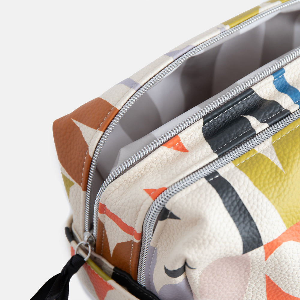 leather look PU large travel wash bag in multicoloured hearts design, with double silver zip opening, side grab handle, grey stripe print lining and black grosgrain zip pull