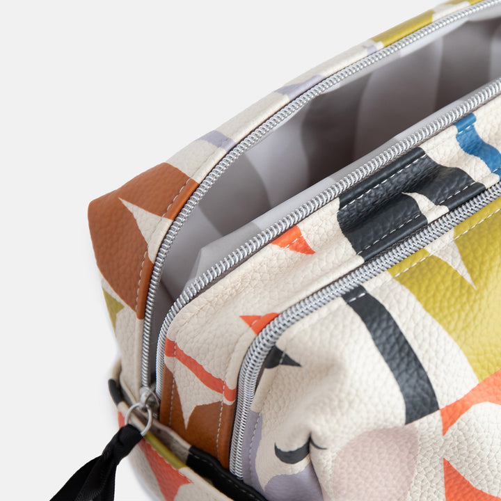 leather look PU large travel wash bag in multicoloured hearts design, with double silver zip opening, side grab handle, grey stripe print lining and black grosgrain zip pull