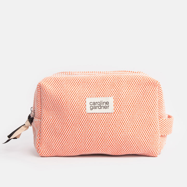 orange woven check large travel washbag with black and white fabric zip pulls and caroline gardner branded tab