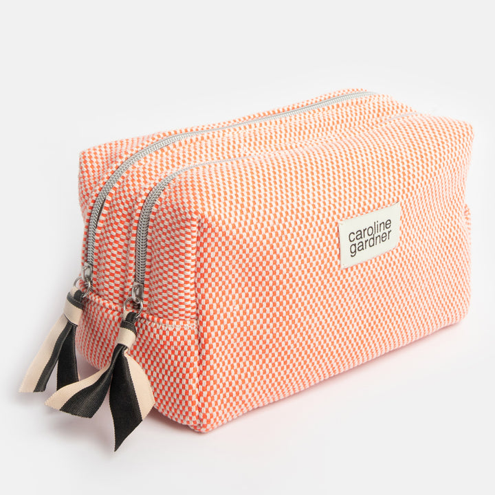 orange woven check large travel washbag with black and white fabric zip pulls and caroline gardner branded tab