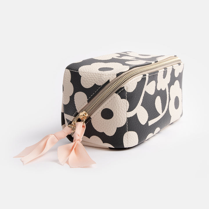 diagonal zip open flat lay cosmetics bag in monochrome flower print