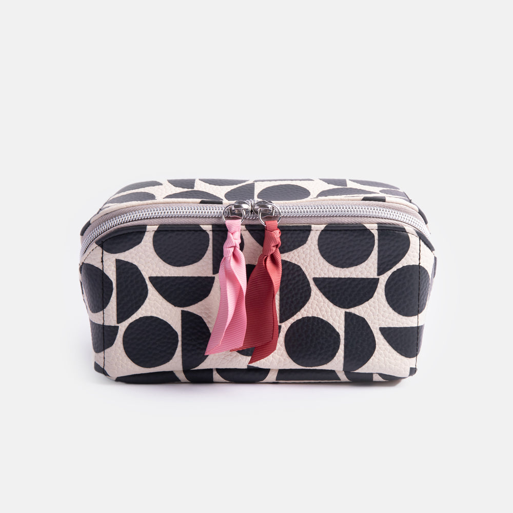 leather look PU lay flat cosmetics bag in monochrome abstract geometric shapes design with striped wipe clean lining 