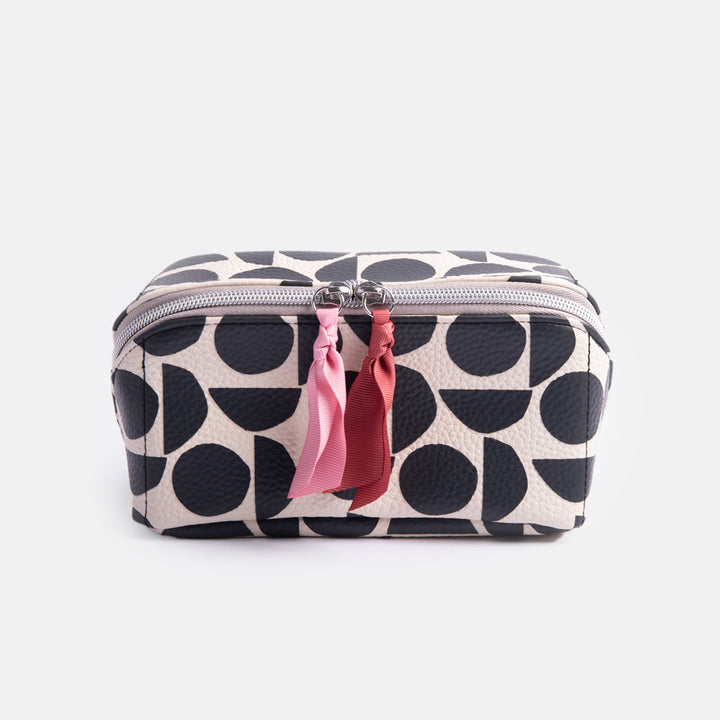 leather look PU lay flat cosmetics bag in monochrome abstract geometric shapes design with striped wipe clean lining 