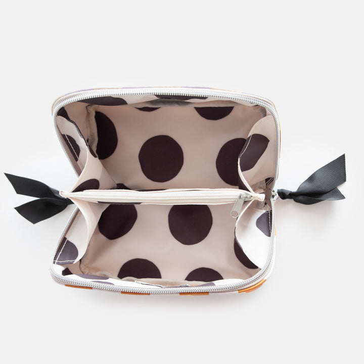 leather look PU lay flat cosmetics bag in warm tones check print with spotty wipe clean lining, silver zip and black grosgrain pull