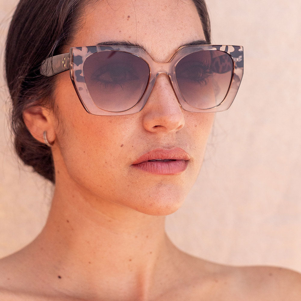 geometric cat eye sunglasses with brown animal print design and brown lenses