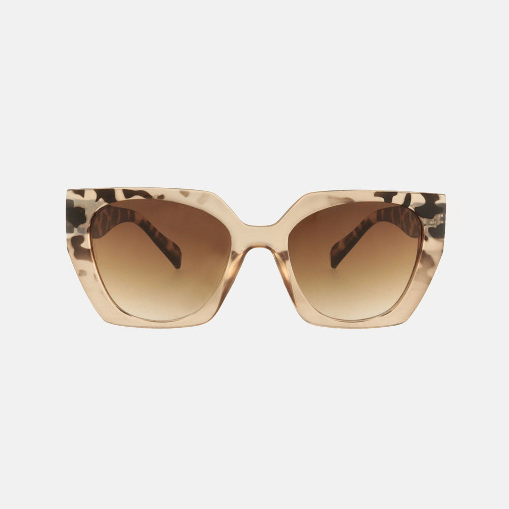 geometric cat eye sunglasses with brown animal print design and brown lenses