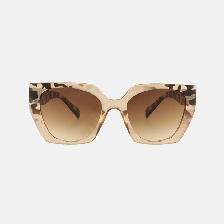 geometric cat eye sunglasses with brown animal print design and brown lenses