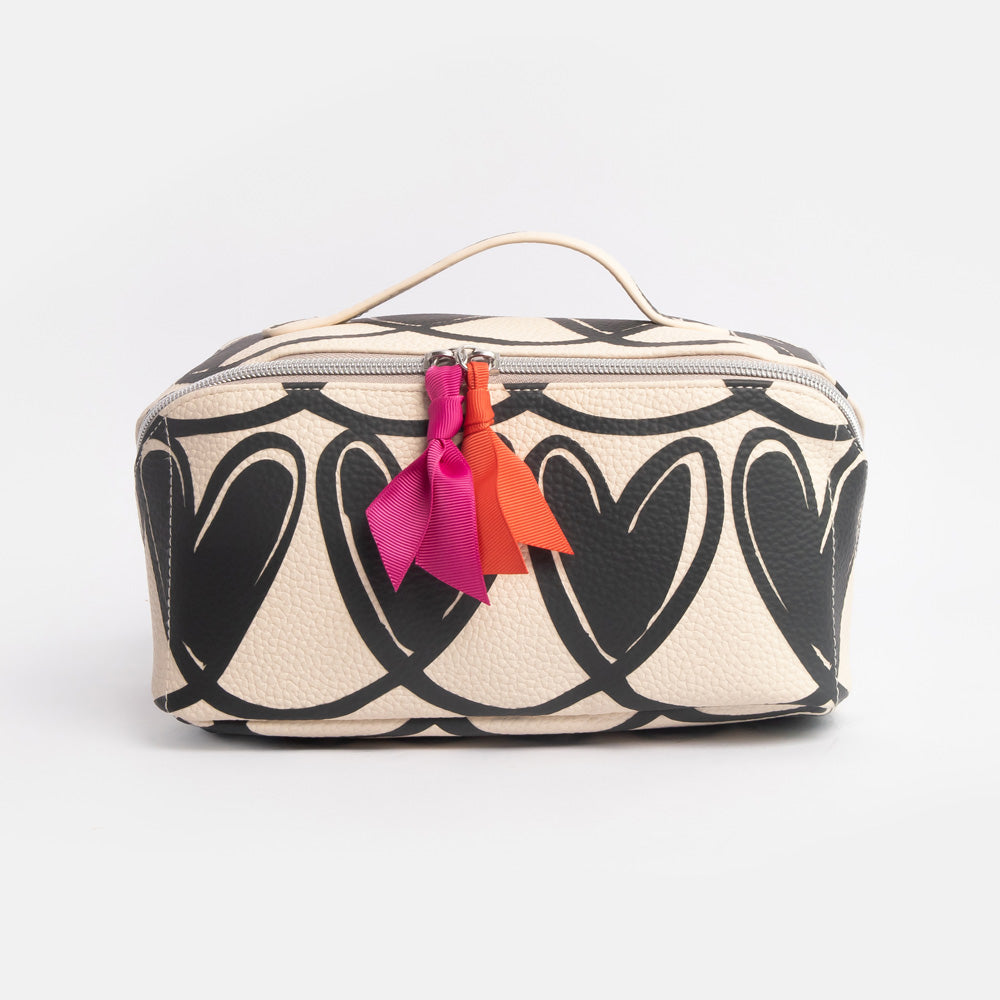 diagonal zip flat lay wash bag with monochrome looped hearts design and contrast orange & pink fabric zip pulls