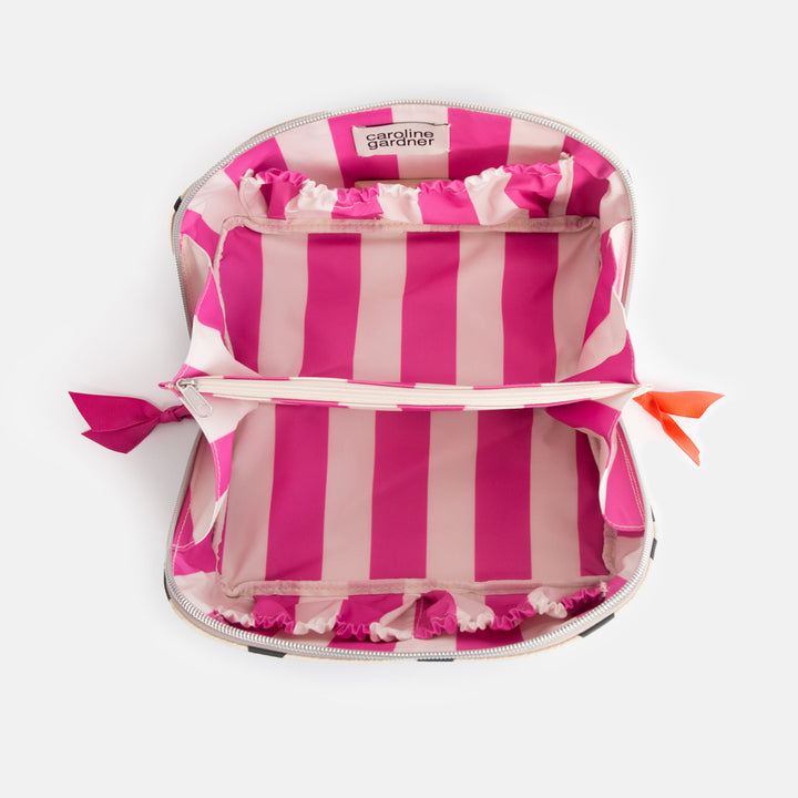 diagonal zip flat lay wash bag with monochrome looped hearts design and contrast bright pink stripe internal lining
