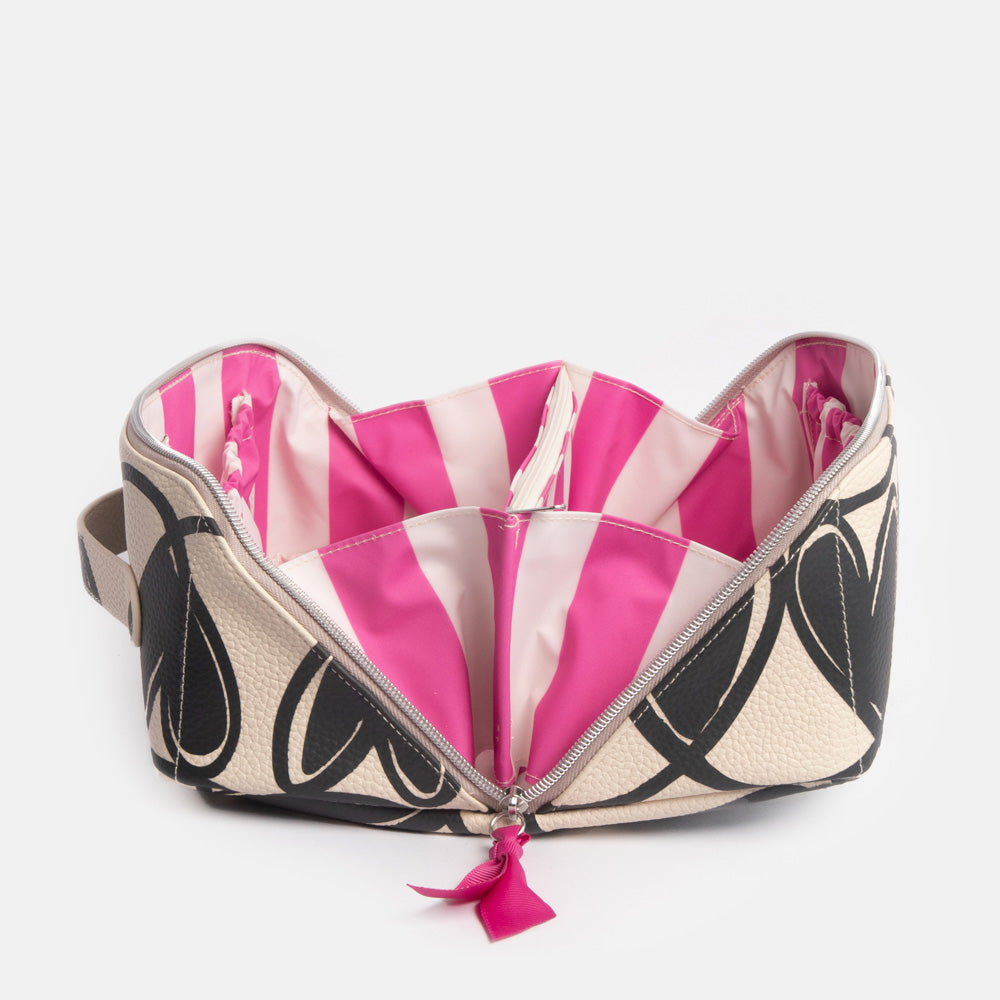 diagonal zip flat lay wash bag with monochrome looped hearts design and contrast bright pink stripe internal lining
