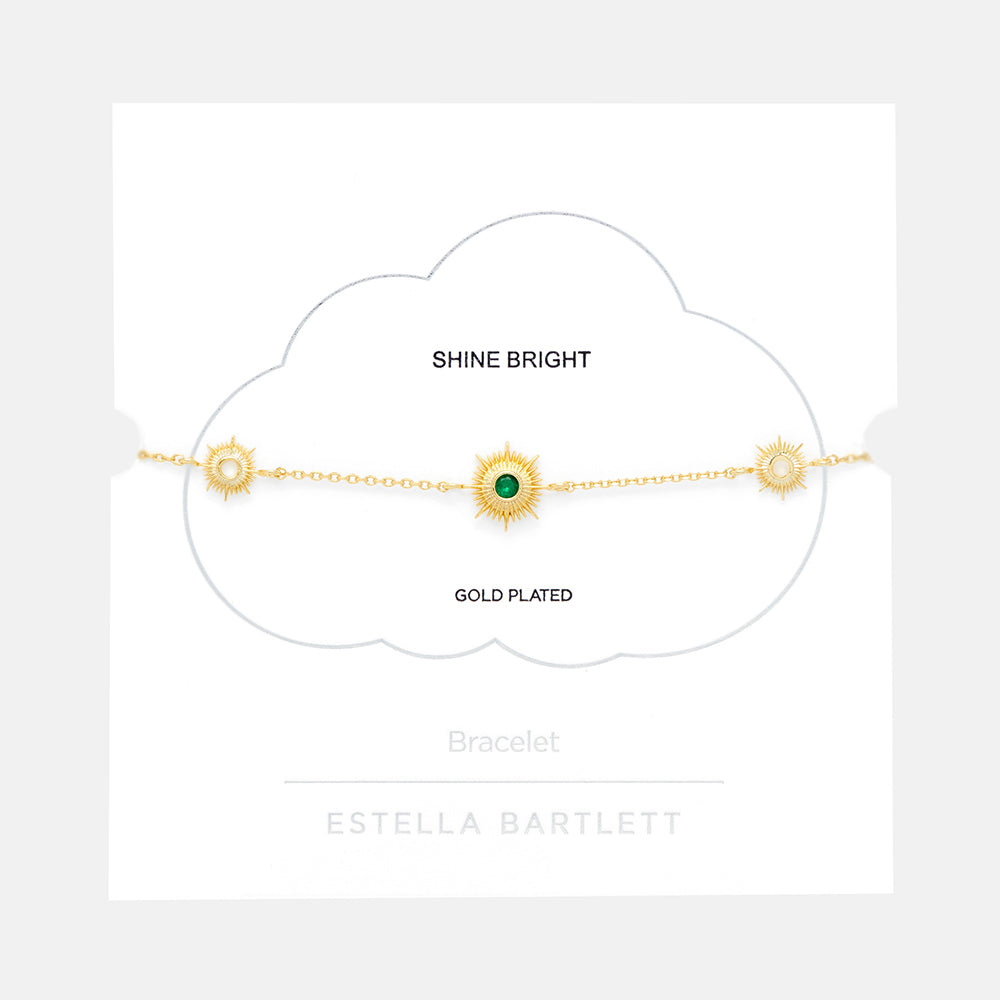 gold plated bracelet with golden sunbursts and green cubic zirconia, made by Estella Bartlett