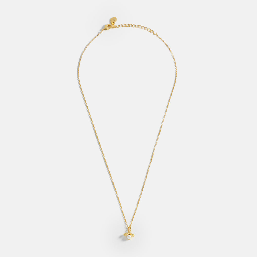gold plated and pearl bee pendant necklace by Estella Bartlett