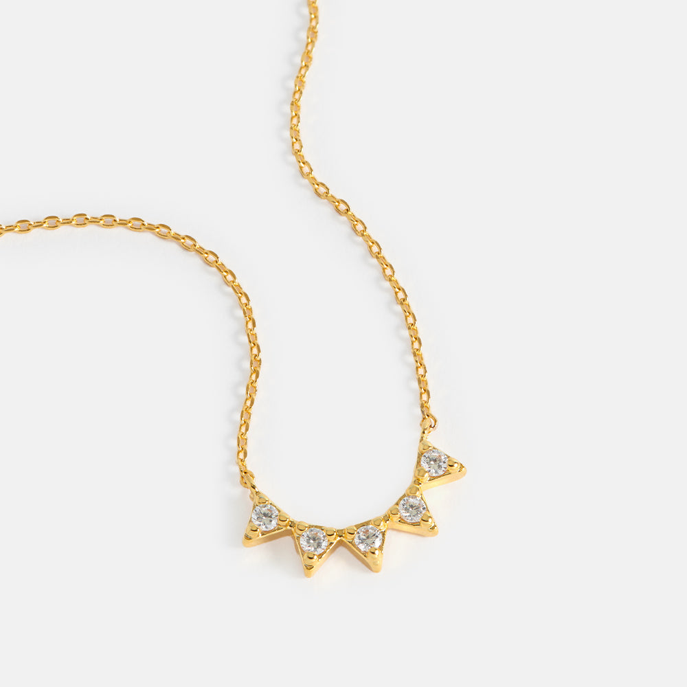 gold plated and cubic zirconia bunting necklace by Estella Bartlett