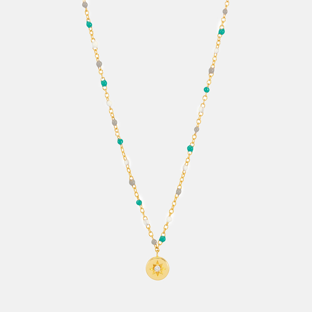 gold plated necklace with coloured enamel beads and disc pendant set with cubic zirconia, made by Estella Bartlett