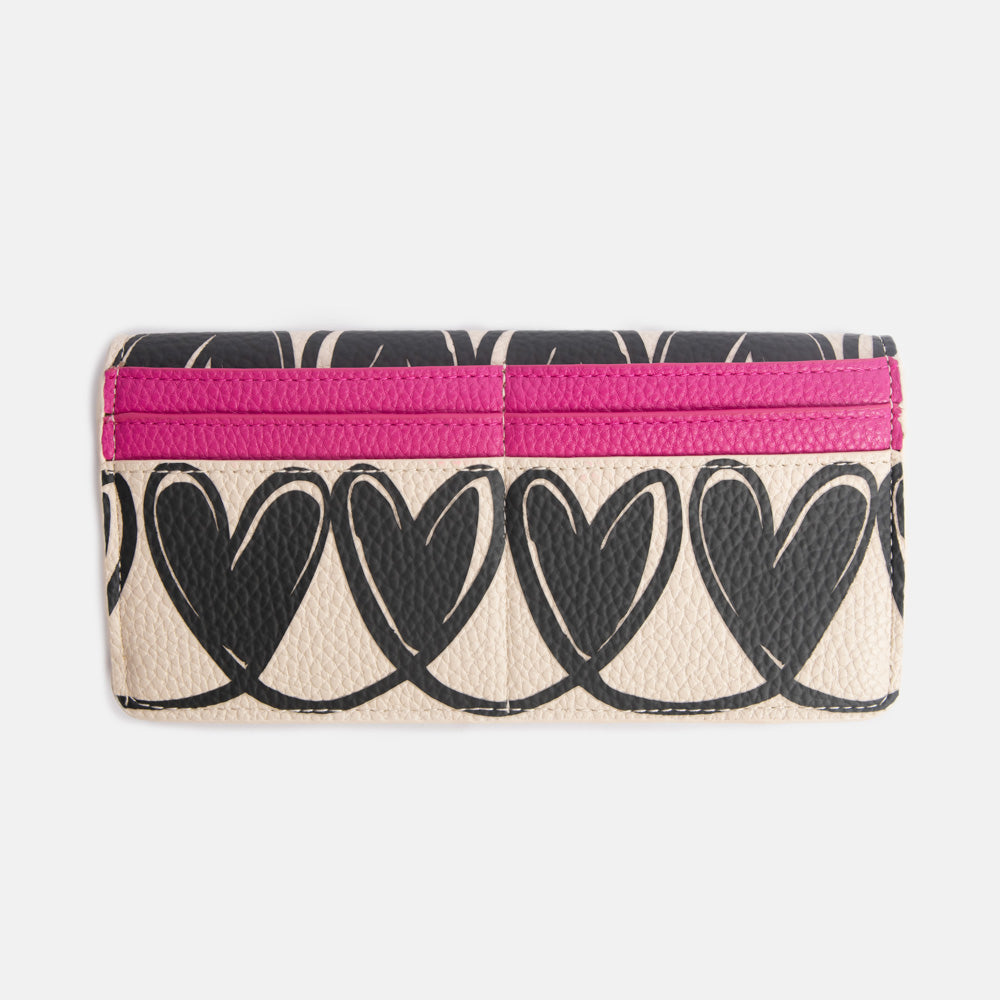 long envelope purse with monochrome looped hearts design and bright pink card slots
