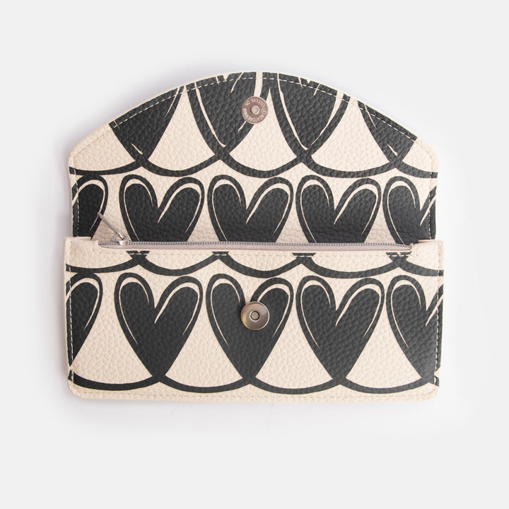 long envelope purse with monochrome looped hearts design, zipped internal pocket and popper overflap closure