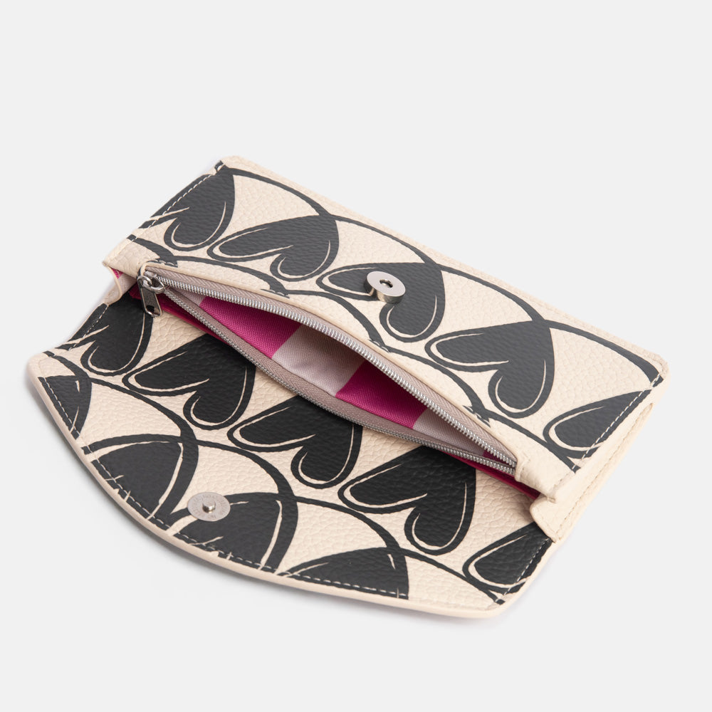 long envelope purse with monochrome looped hearts design with zipped internal pocket with bright pink stripe lining