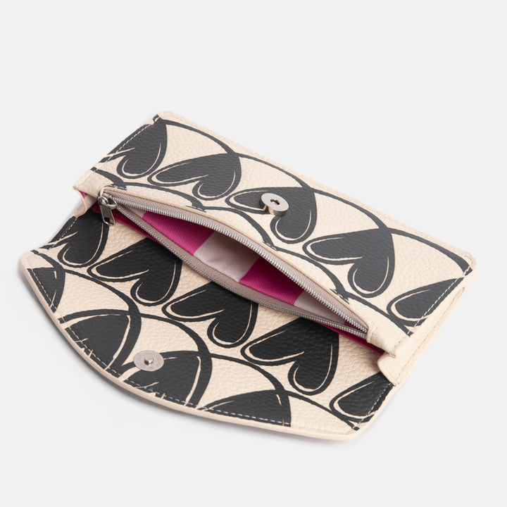 long envelope purse with monochrome looped hearts design with zipped internal pocket with bright pink stripe lining