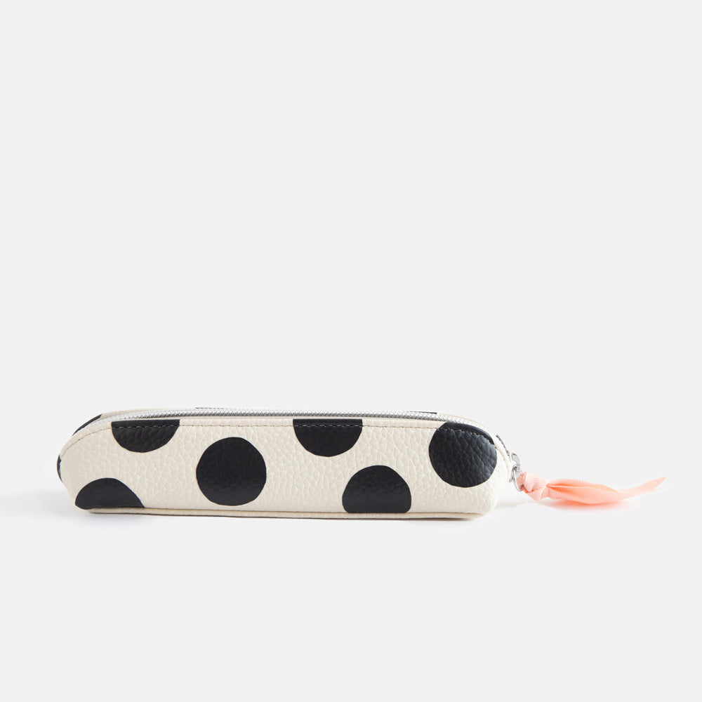 leather look PU slim pencil case in a big black spots design with a pink ribbon zip pull and striped lining
