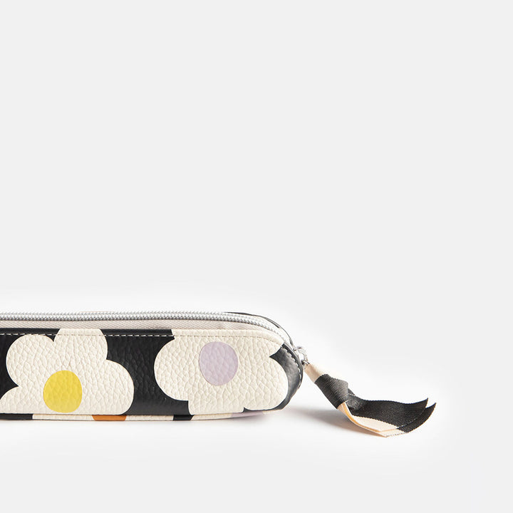 leather look PU slim pencil case in a cream flowers on charcoal background design with a black and white ribbon zip pull and grey striped lining
