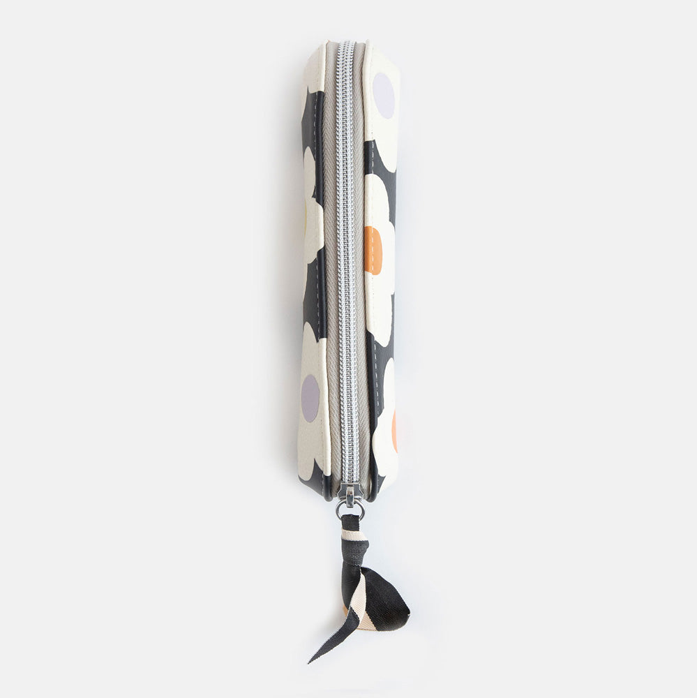 leather look PU slim pencil case in a cream flowers on charcoal background design with a black and white ribbon zip pull and grey striped lining