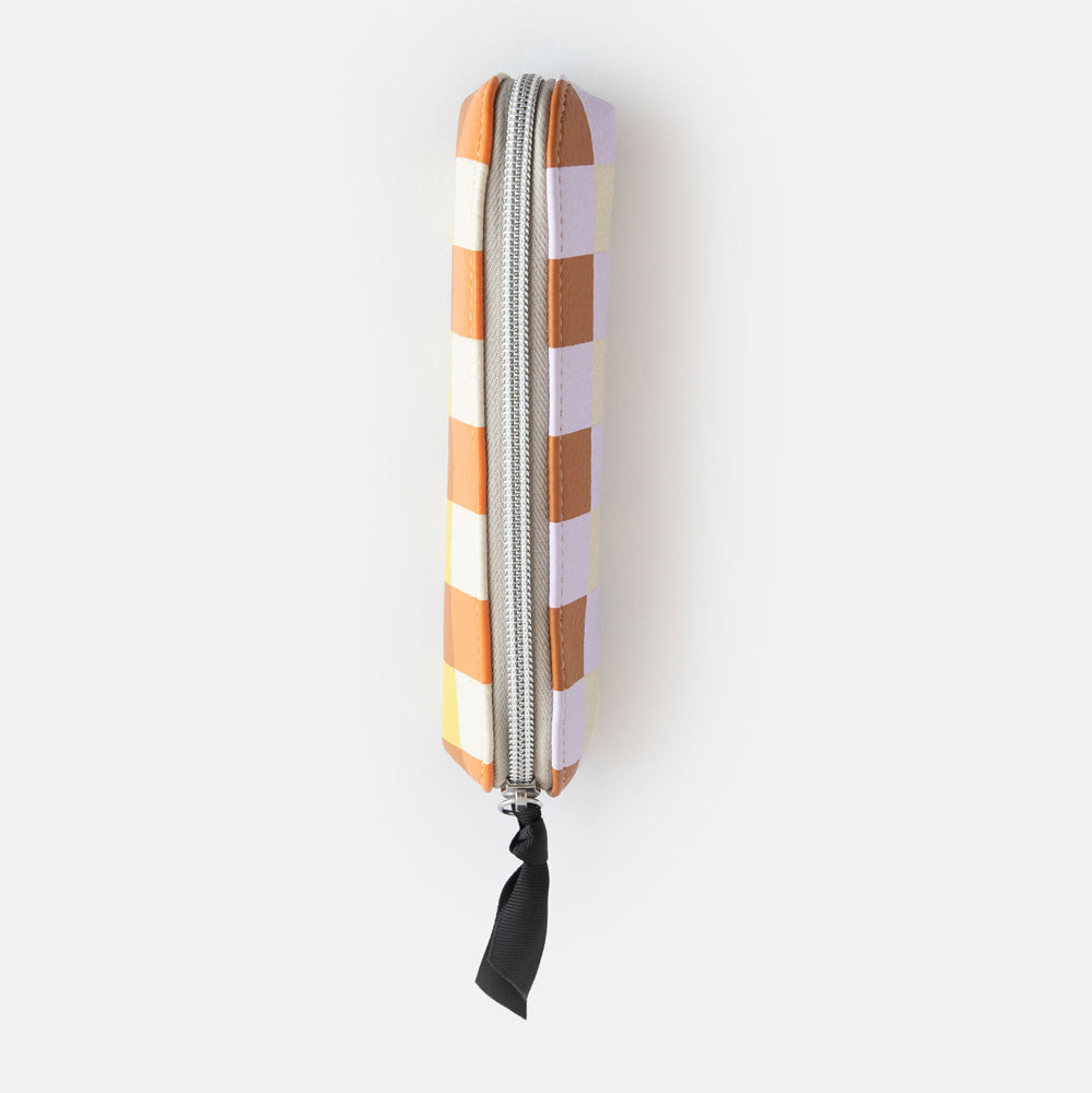 leather look PU slim pencil case in a warm tones check design with a black ribbon zip pull