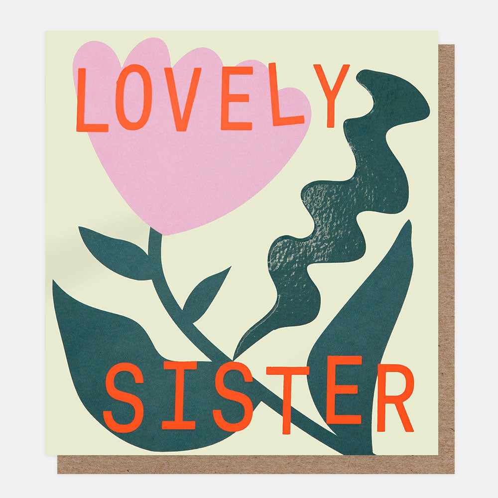 Greeting card with 'Lovely Sister' text and a heart-shaped flower on a beige background
