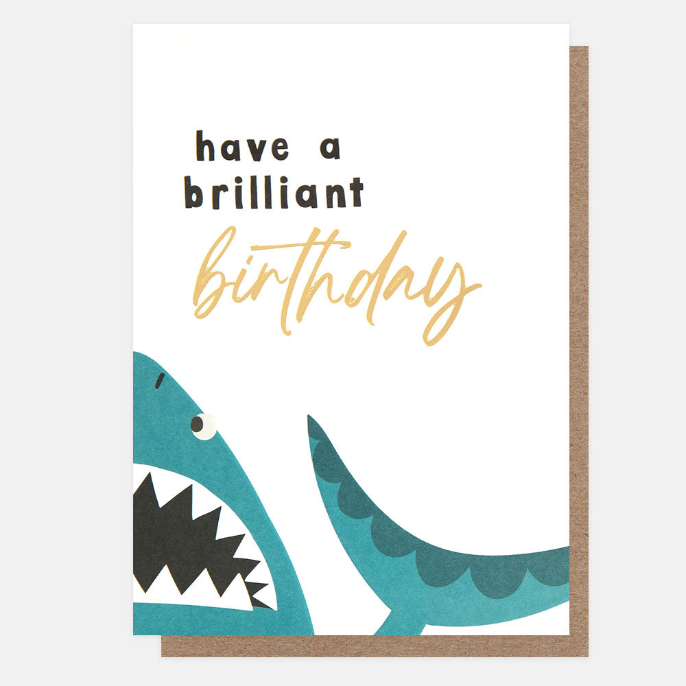 birthday card featuring a blue shark centered on the card fold and 'have a brilliant birthday" message
