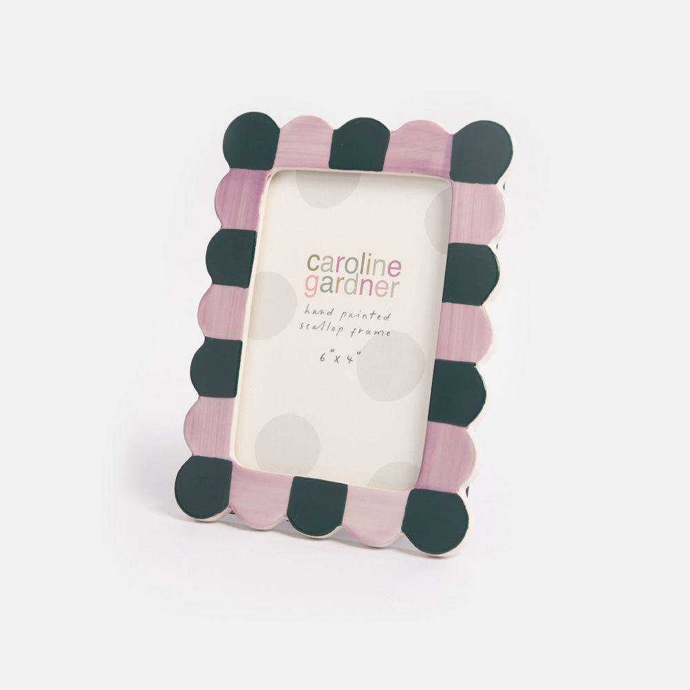 Decorative photo frame with lilac and teal scalloped design on a white background