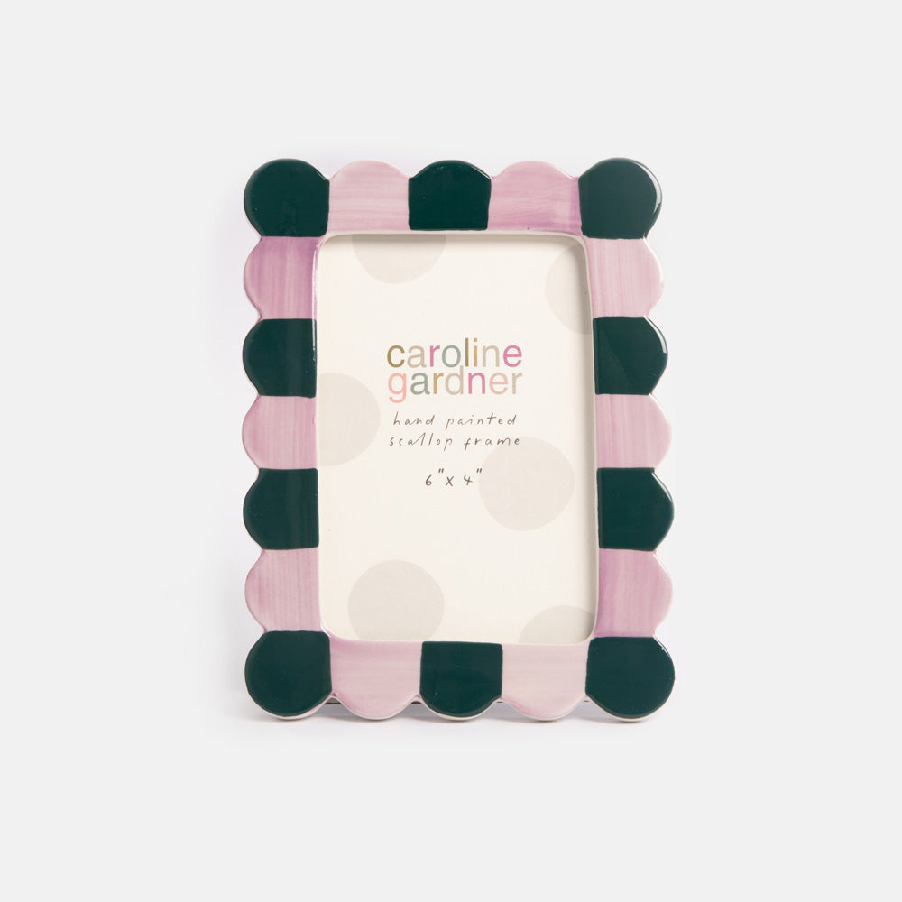 Decorative photo frame with lilac and teal scalloped design on a white background