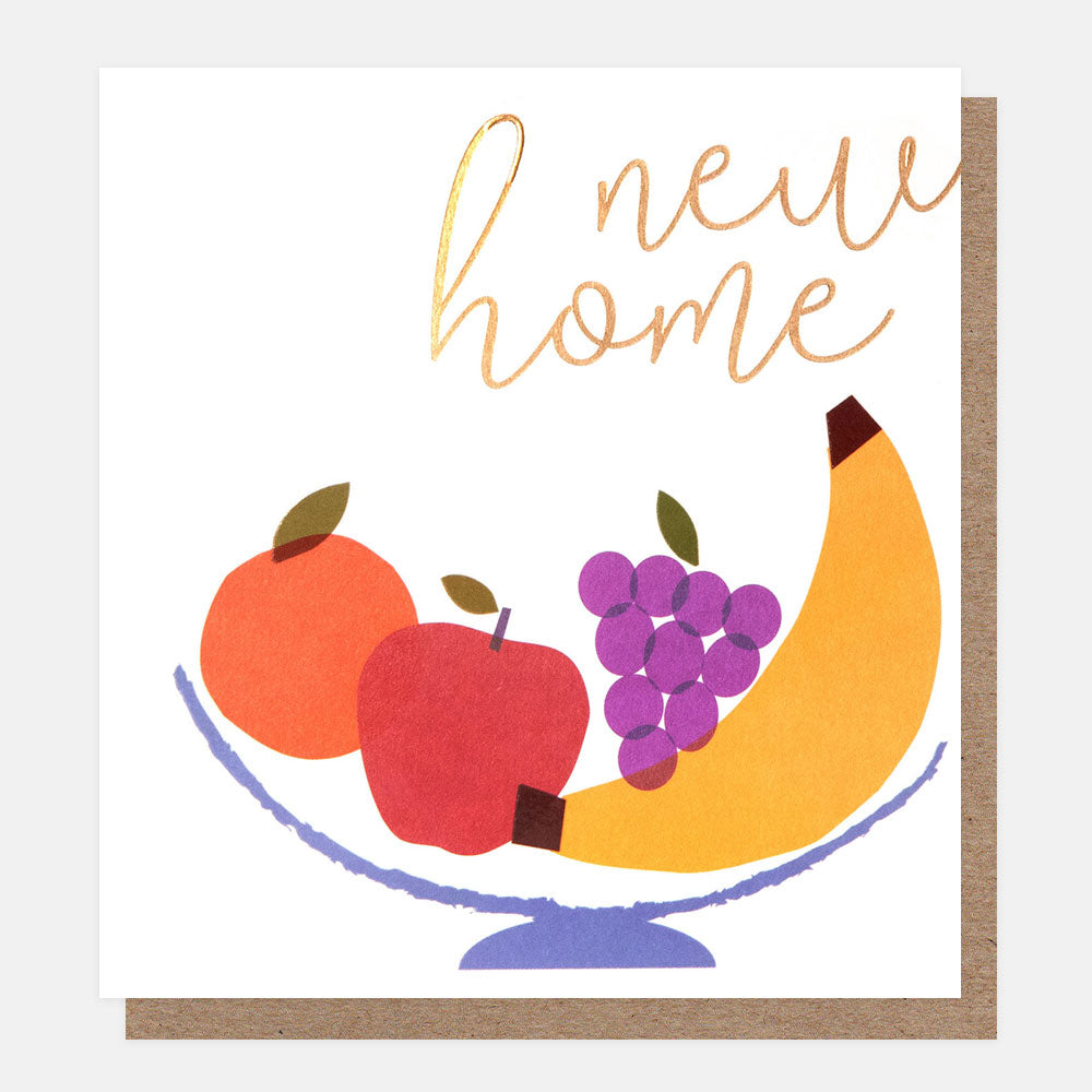 greetings cards featuring a bowl of fruit and the text 'new home' in gold 