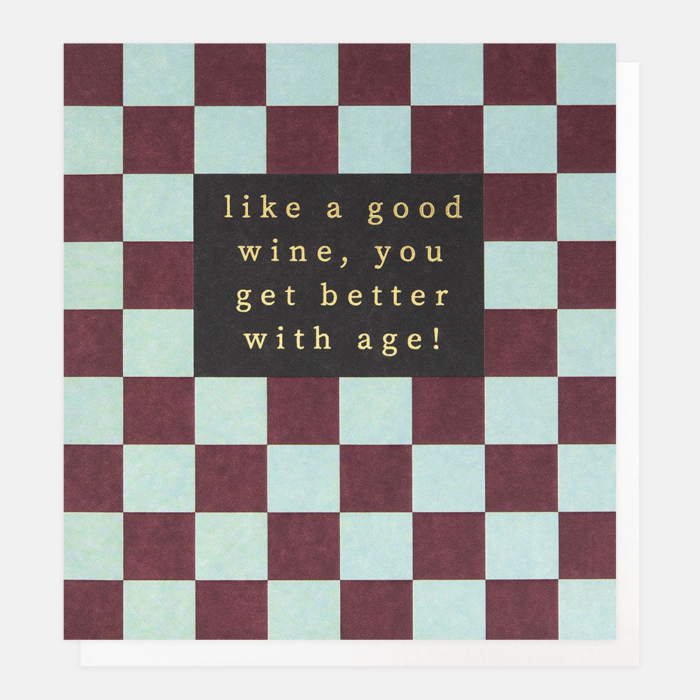 birthday card featuring a checkerboard pattern in burgundy and light blue and 'like a good wine, you get better with age' message in gold foil
