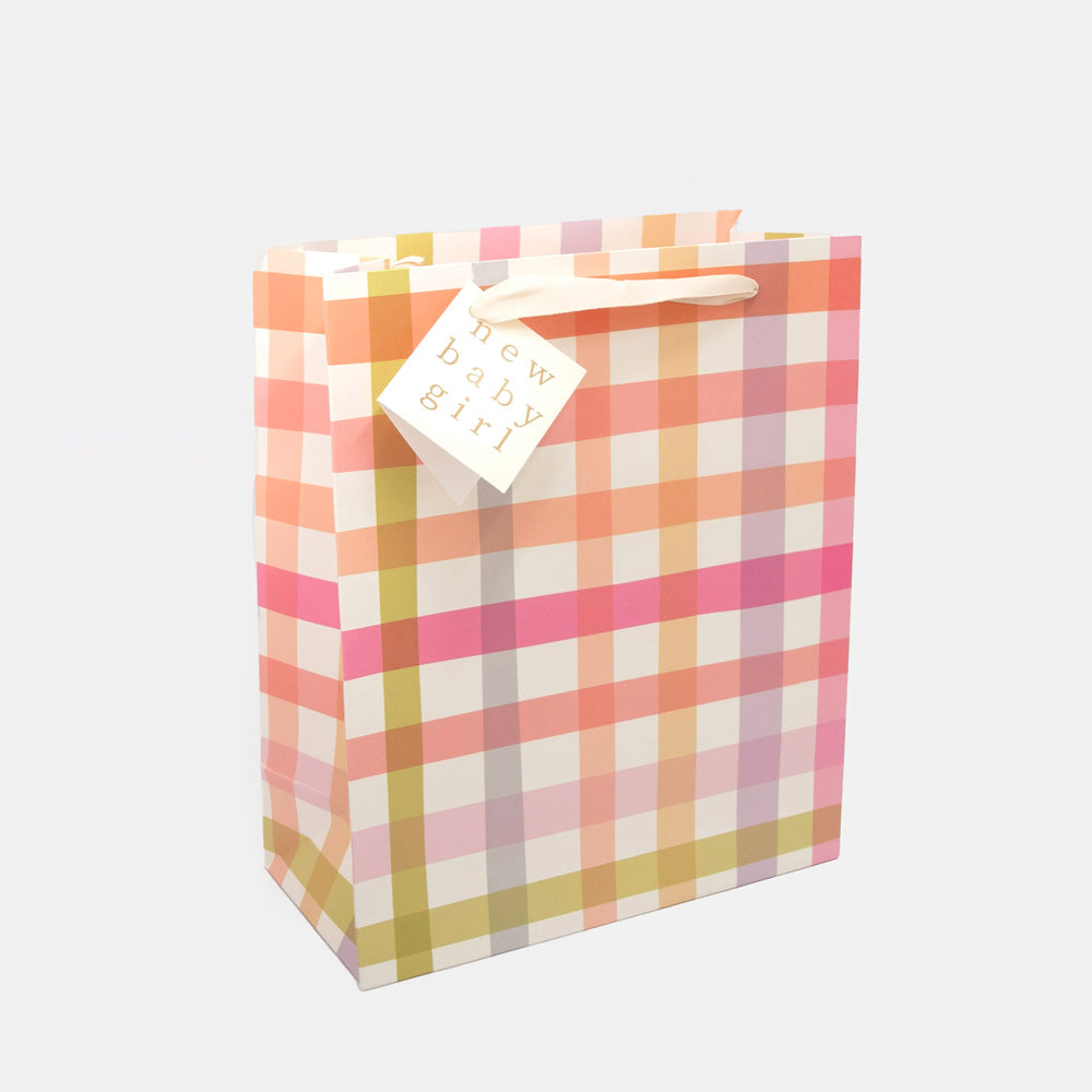 pink, yellow & lilac check large gift bag with gift tag with the words 'new baby girl' on