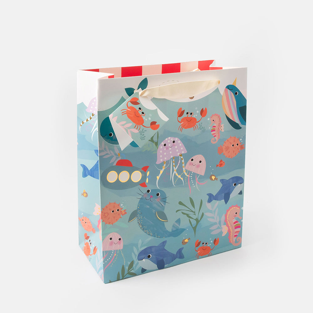 gift bag and matching gift tag set  featuring design of hand drawn under water animals, with seal, jellyfish, crabs, shark and seahorses