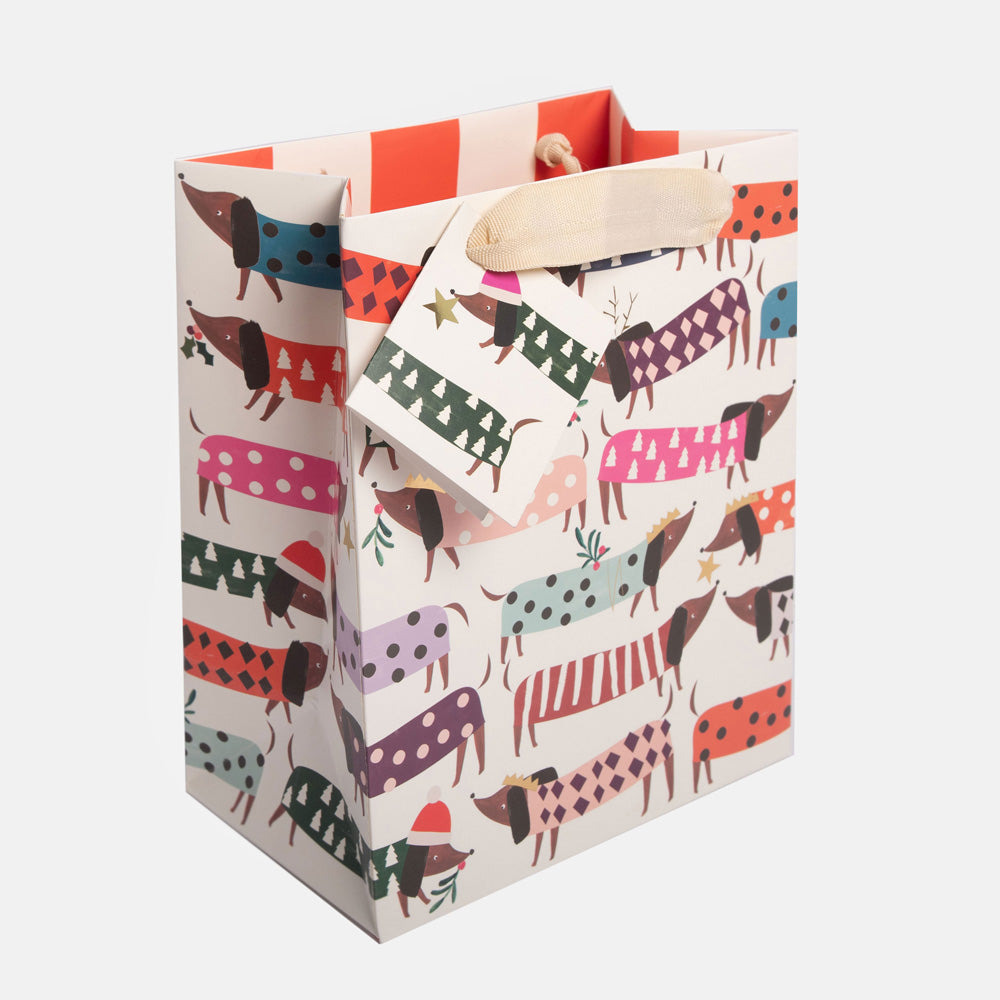 sausage dogs in colourful patterned jumpers gift bag with matching gift tag and fabric handles
