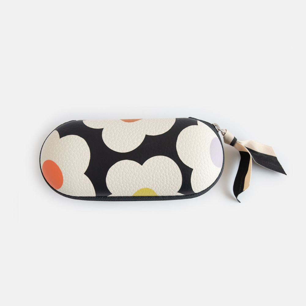 leather look hard glasses case in colourful flowers print with suedette lining and black and white ribbon zip pull