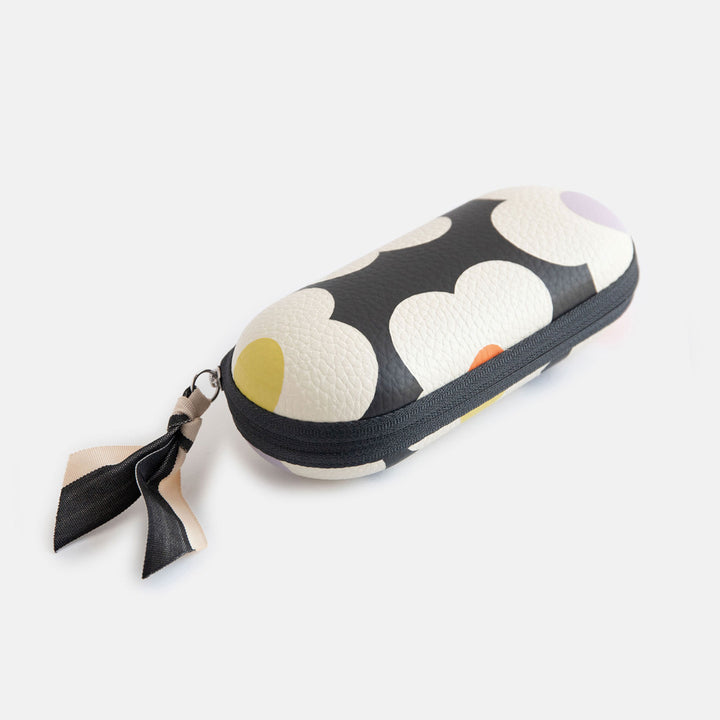 leather look hard glasses case in colourful flowers print with suedette lining and black and white ribbon zip pull
