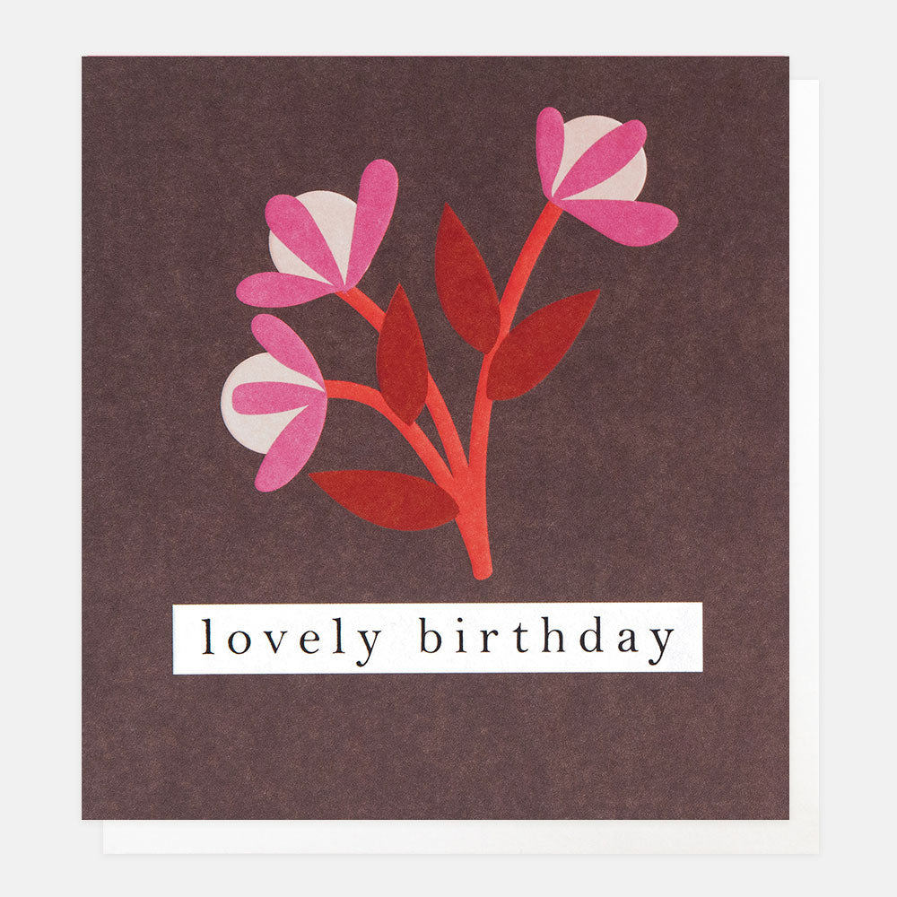 Birthday card with pink and red floral design and 'lovely birthday' text on a burgundy background