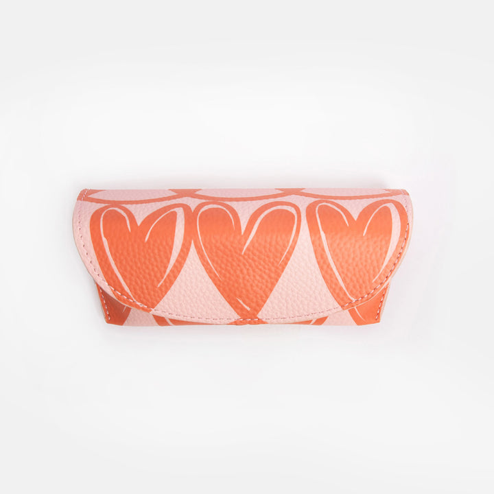 pink flap close glasses case with orange looped hearts design