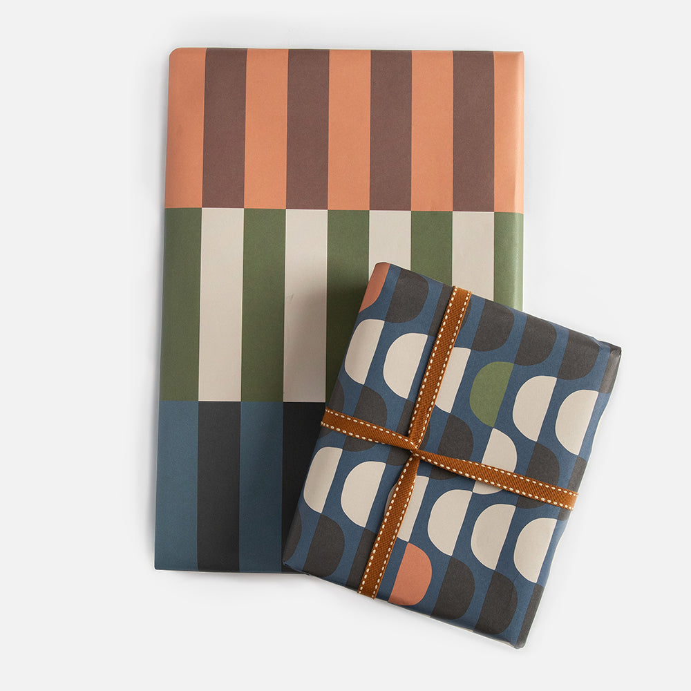 double sided wrapping paper sheet with retro stripe design on one side and geometric circles on the other
