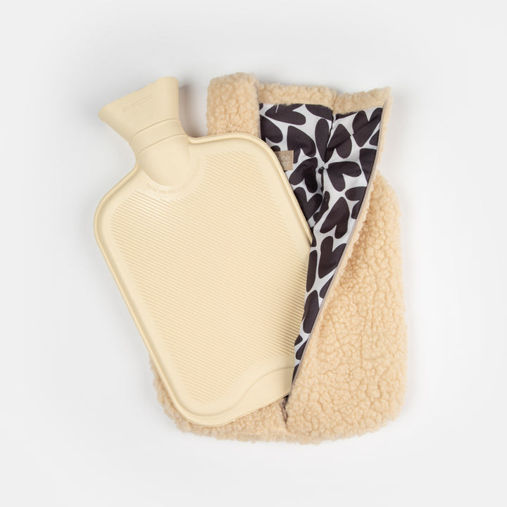 natural borg fleece hot water bottle with monochrome black and white hearts lining