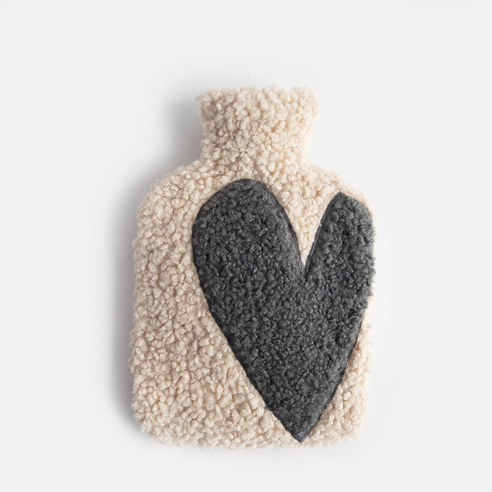 Borg hot water bottle with dark grey heart design on an oatmeal background
