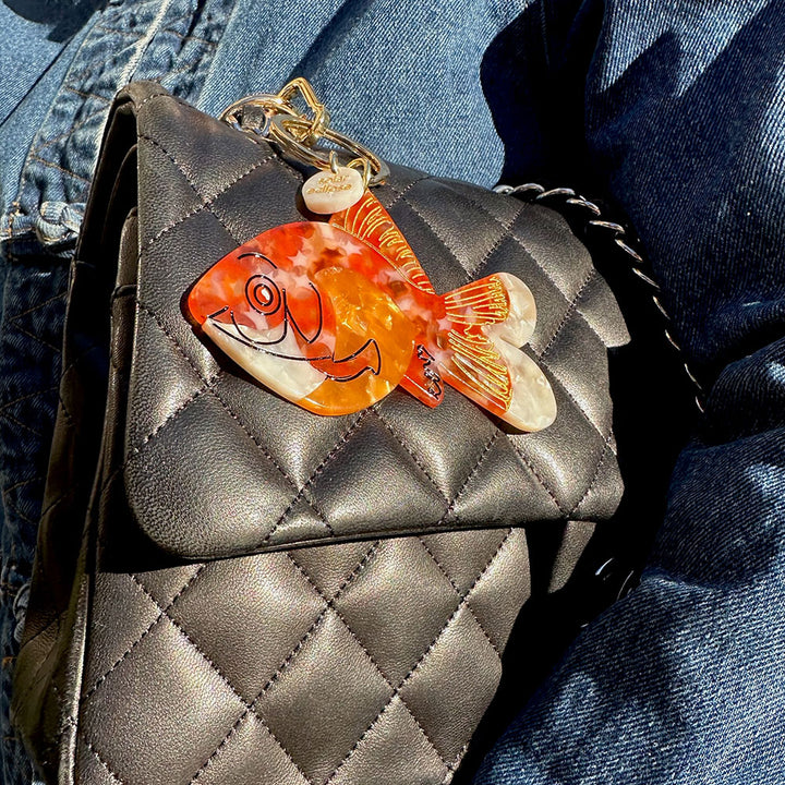 goldfish bag charm or keyring on black leather bag